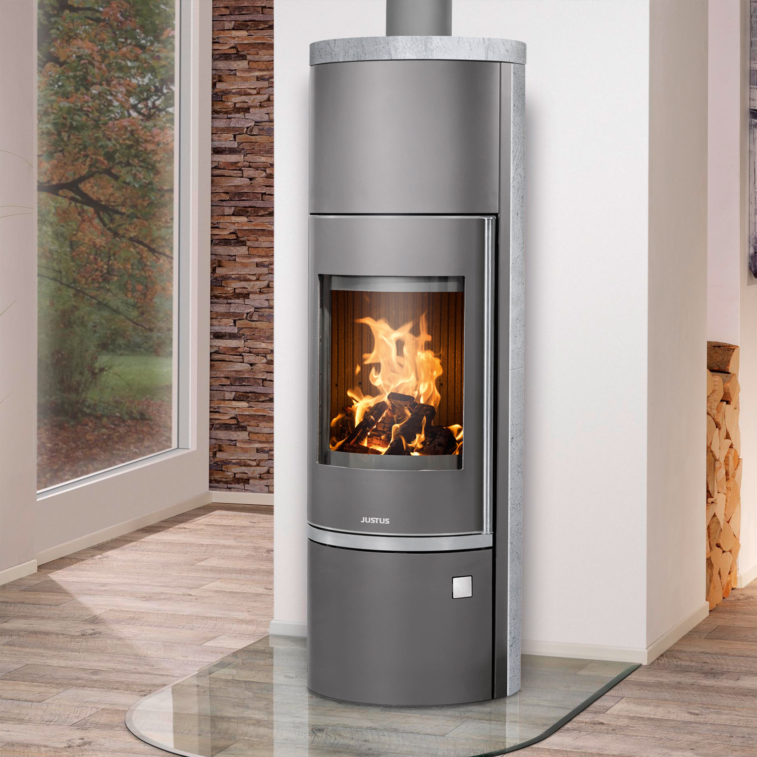 Justus Faro Aqua 2.0 Poêle à bois hydraulique en acier gris fonte avec revêtement en stéatite. Justus Faro Aqua 2.0 Poêle à bois hydraulique en acier gris fonte avec revêtement en stéatite.