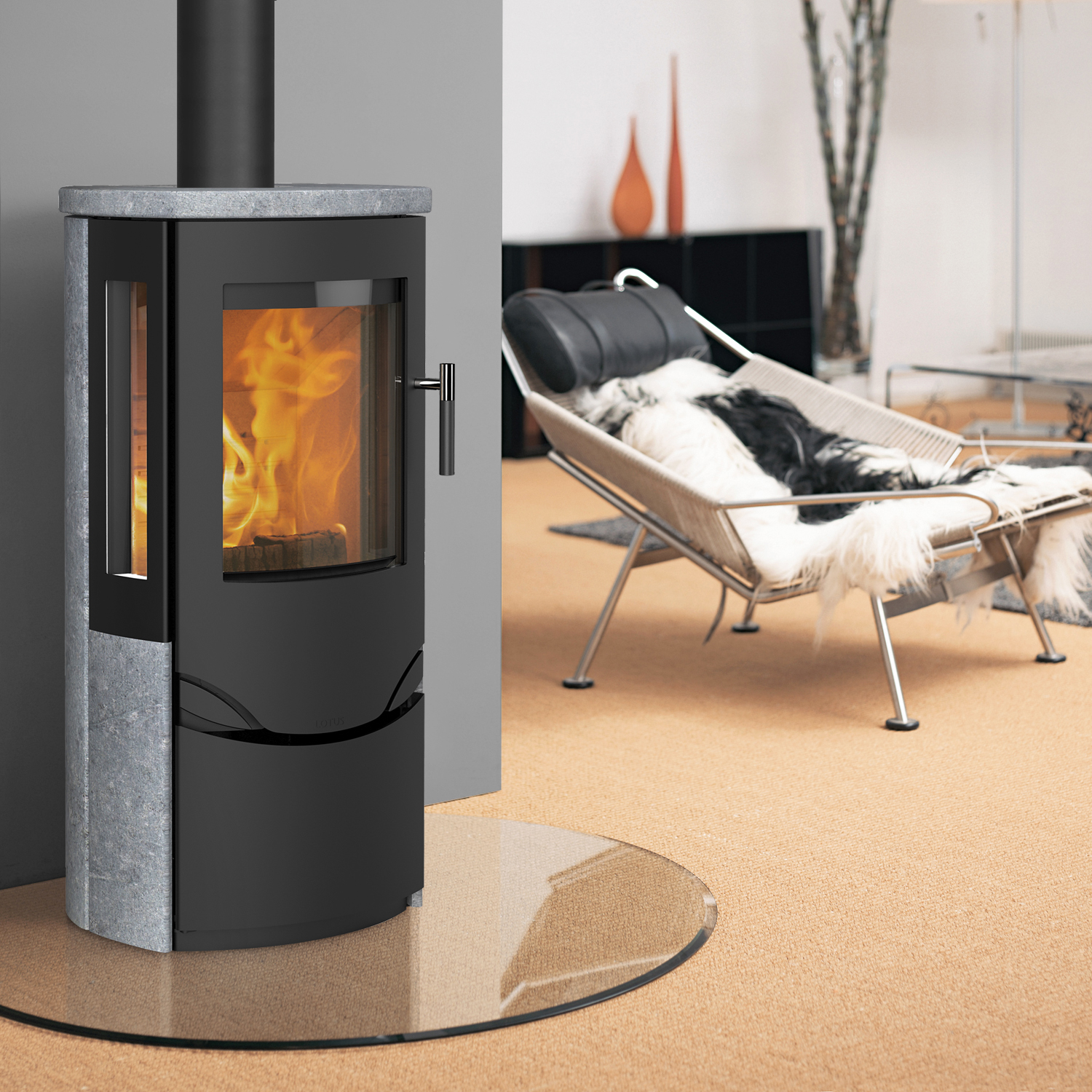 Poêle à bois Lotus Prio 6S Noir / Pierre ollaire, évacuation des fumées par le haut Poêle à bois Lotus Prio 6S Noir / Pierre ollaire, évacuation des fumées par le haut